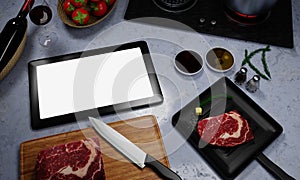 Learn to cook online. How to cook food and recipes from the internet. Meat for cooking steak on the pan. There is butter and