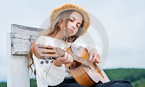 Learn to play the guitar diligently. girl enjoy the moment. Have Fun on Celebration. kid singing with guitar. teen