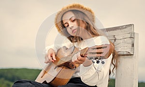 Learn to play the guitar diligently. girl enjoy the moment. Have Fun on Celebration. kid singing with guitar. teen