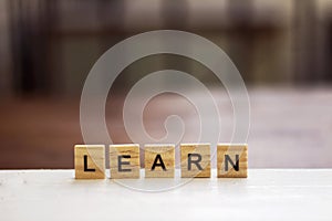 Learn word written on wood block. Word LEARN formed by wood alphabet blocks.