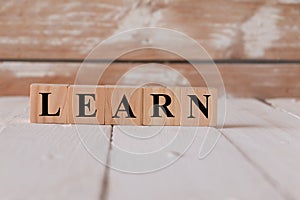 LEARN words. Alphabets written on wooden block