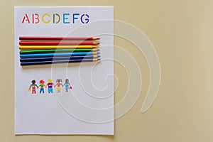 Learning ABCs with rainbow colouring pencils hand drawn children copy space