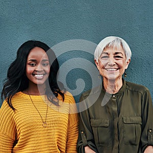 Learning from the best every day. Portrait of a cheerful mature and young businesswoman posing together against a wall