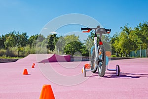 Learning a bike concept - baby bicycle with extra wheels