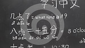 Learning Chinese to tell time in class room