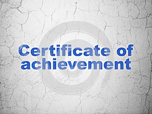 Learning concept: Certificate of Achievement on wall background