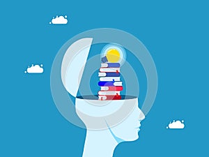 Learning concept. stack of books inside a human head with a light bulb