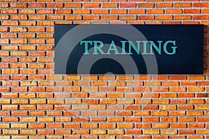 Learning concept: Training text on black brick wall background