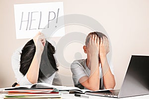 Learning difficulties, remote education, online learning and working at home. Tired mother and sad kid need help to do