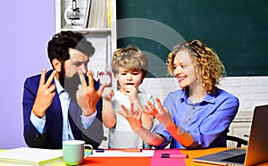 Learning and education. Schoolboy with teachers study mathematics and counting on fingers. Mathematics for children in