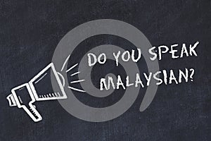 Learning foreign languages concept. Chalk symbol of loudspeaker with phrase do you speak malaysian