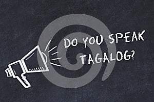 Learning foreign languages concept. Chalk symbol of loudspeaker with phrase do you speak tagalog photo