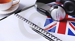 Learning foreign languages. Notepad for entries and a flag. Lang