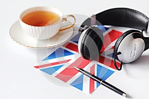 Learning foreign languages. Notepad for entries and a flag. Lang