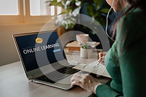 Learning Online Concept. Young Woman using Computer Laptop to Learn an E-Learning Course from the Internet