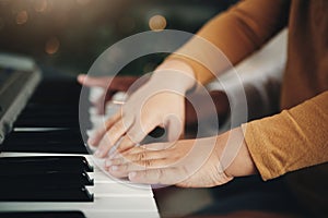 Learning, piano and hands of a child and parent playing a song together. Education, music and zoom of a kid with a dad