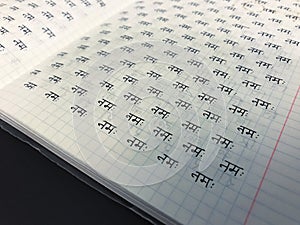 Learning sanskrit devanagari hindi alphabet handwritten in copybook