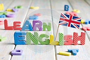 Learning speaking and teaching english with british flag abstract background concept