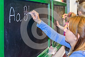 Learning to write ABC on the blackboard