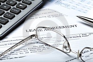 Lease Agreement Documents with Glasses, Pen and