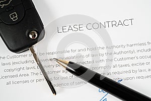 Lease contract with a pen and car keys