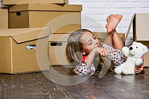 Lease a lifestyle makeover. happy child cardboard box. Moving concept. new apartment. purchase of new habitation