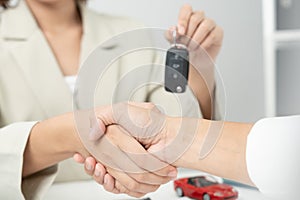 lease, rental car, sell, buy. Dealership manager send car keys to the new owner. Sales, loan credit financial, rent vehicle,