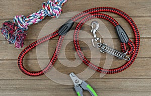 Leashes for pet with nail scissors on wooden table