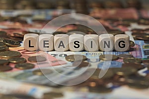 Leasing - cube with letters, money sector terms - sign with wooden cubes