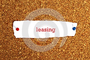 Leasing word on white paper