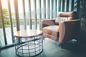 Leather arm chair in relax zone at coffee shop , Calm corner