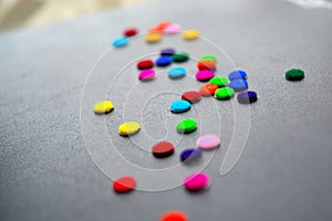 leather background and colorful circle sticker