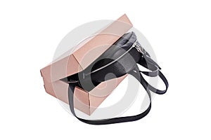 Leather backpack in a cardboard box.