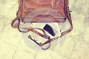 Leather bag with blank diary, cell phone