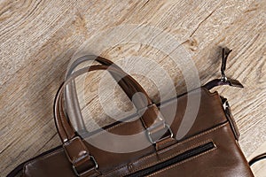 Leather bag on wooden board