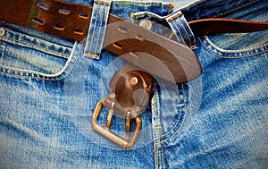 Leather belt on old jeans