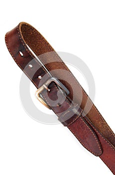 Leather belt on a white background. Close-up.