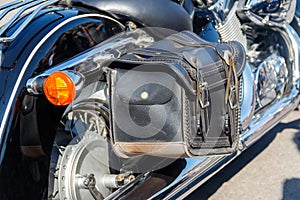 Leather biker bag on motorcycle close-up. Concept travel on a motorcycle