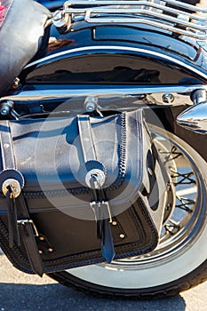 Leather biker bag on motorcycle close-up. Concept travel on a motorcycle