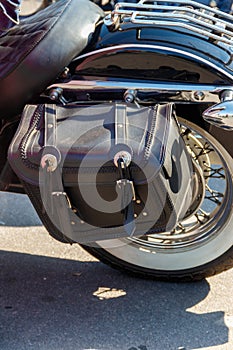 Leather biker bag on motorcycle close-up. Concept travel on a motorcycle