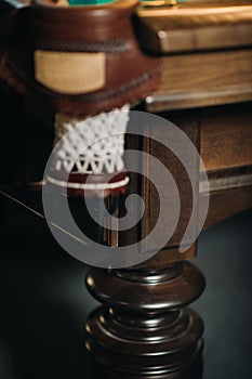 Leather billiard hole and table leg in a billiard club