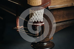 Leather billiard hole and table leg in a billiard club