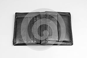 Leather black wallet for money on a gray background