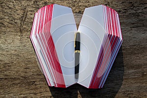 Leather book in shape of coffin, with a pencil on it