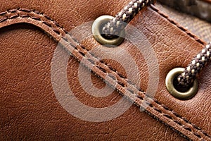 Leather boots stitched with thread close-up