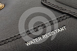 Leather boots stitched with thread close up