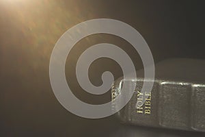 Leather Bound Holy Bible on a Black Table