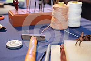 leather craft DIY instrument tool. craftsman working desk