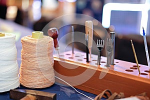 leather craft DIY instrument tool. craftsman working desk