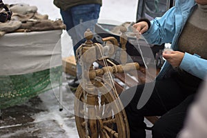 Leather craft tools,thread and buckles on winter background